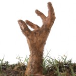 Hand emerging from the ground